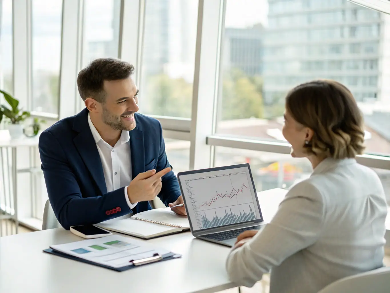 A consultant presenting a budget forecast to a business owner, using charts and graphs to illustrate financial projections and potential growth scenarios.